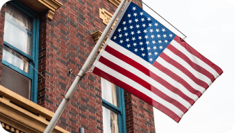 American flag on a brick building